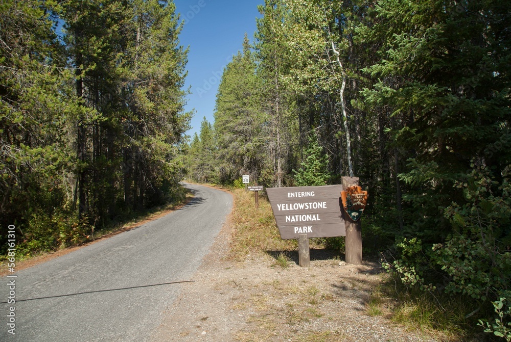 Entrance sign along Cave Road for Yellowstone National Park, Wyoming