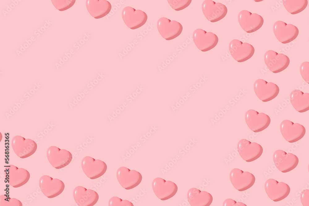 Valentines day creative pattern with baby pink hearts on pastel pink background. 80s or 90s retro fashion aesthetic love concept. Minimal romantic idea with copy space.