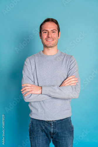 Confident young man with crossed arms