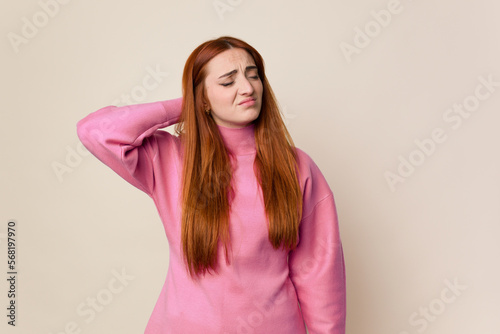 Young red hair woman isolated tired and very sleepy keeping hand on head.