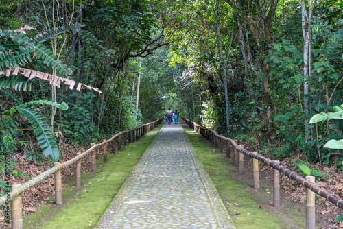San Agustin (San Agustín), Huila, Colombia : stone path in the archaeological park with tourists walking. photo
