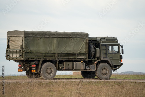 British army MAN SV 4x4 logistics lorry moving along a country track