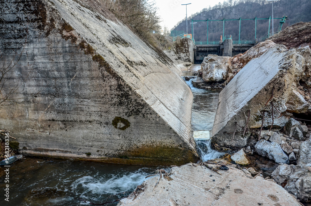 Concrete riverbed. Destroyed river. Construction of the hydroelectric power plant.