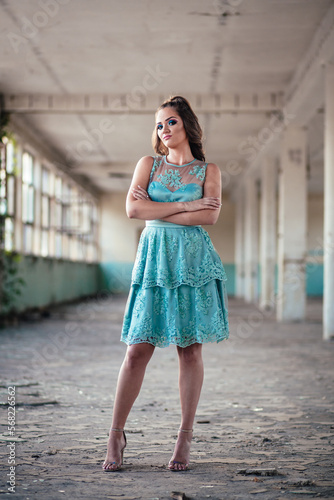 Portrait of young, teen girl in blue lace dress, ready for her prom night