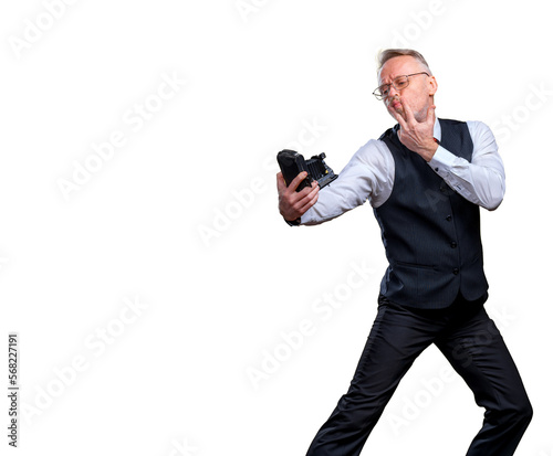 Canvas Print Senior man looking at camera while taking silly face selfie waving to the camera