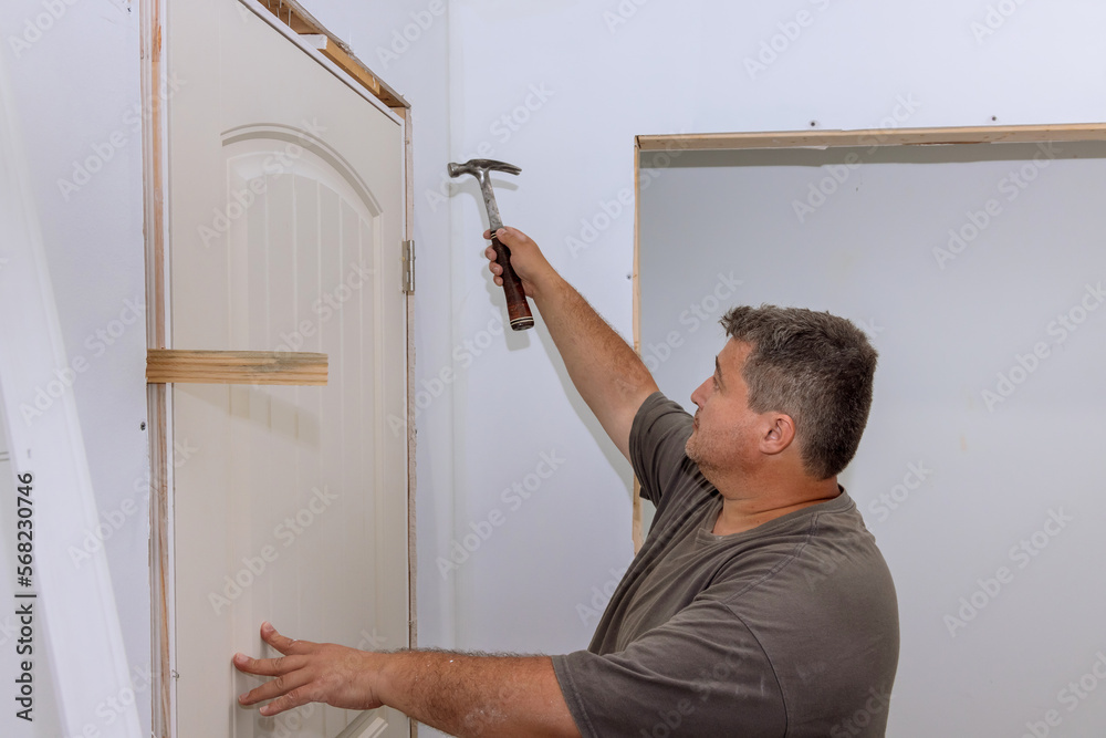 As trim carpenter, during installation of new house, hammer are used to attach doors to interior