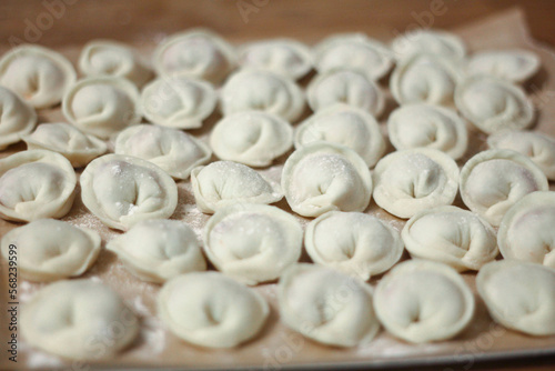 Fresh homemade dumplings handmade lie on the table