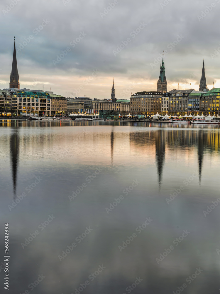 Hamburg city on Binnenalster lake during sunset, Germany Hamburg city on Binnenalster lake during sunset, Germany