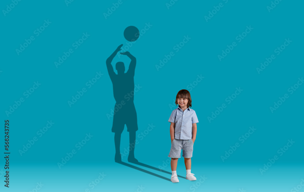 Cute little boy and shadow of adult basketball player behind Cute little boy and shadow of adult basketball player behind