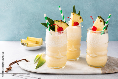 Tropical pina colada cocktail or mocktail in a tiki glass