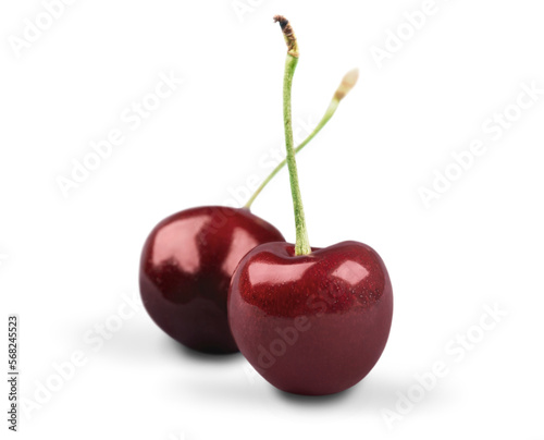 Delicious fresh cherries with leaves over white background