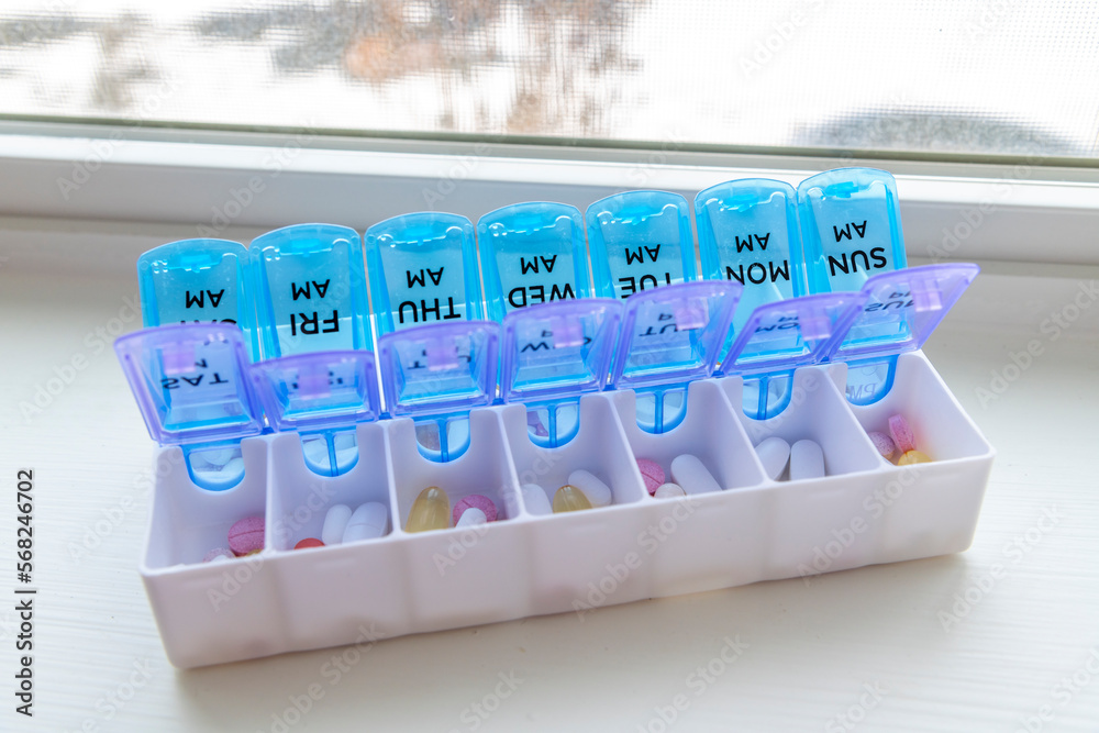 A full pill box or vitamin organizer with the days of the week
