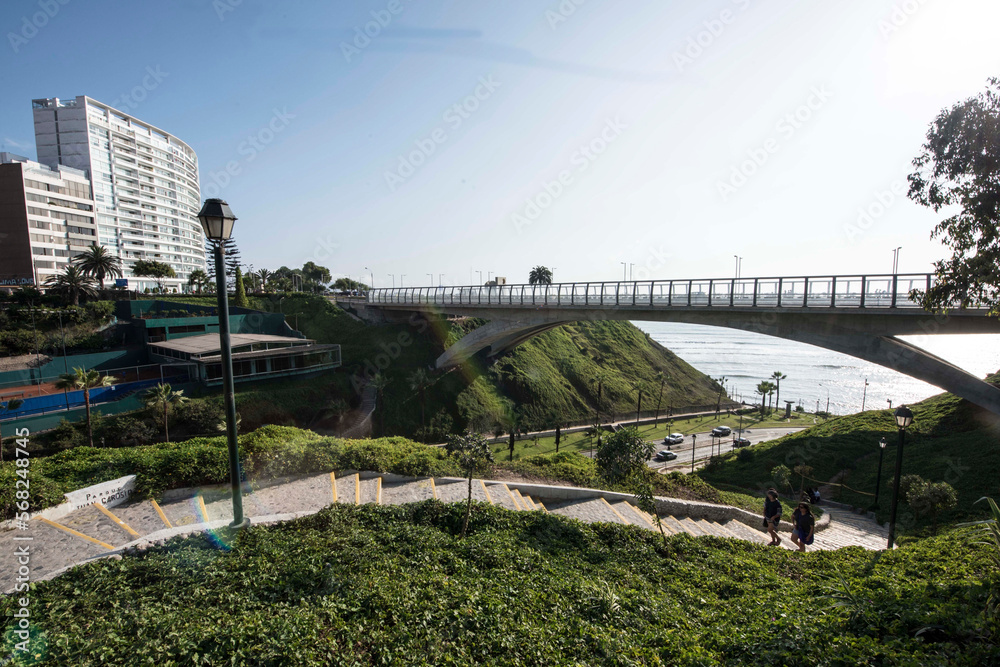 Fototapeta premium The Villena Rey Bridge in Miraflores district in Lima, June 2018- luxury building and ocean pacific Peru. Panoramic view