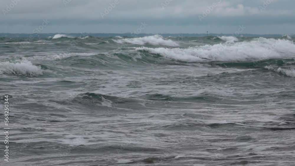 foamy sea waves crashing on the shore foamy sea waves crashing on the shore