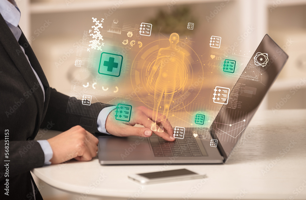 Doctor working on laptop with healthcare concept Doctor working on laptop with healthcare concept