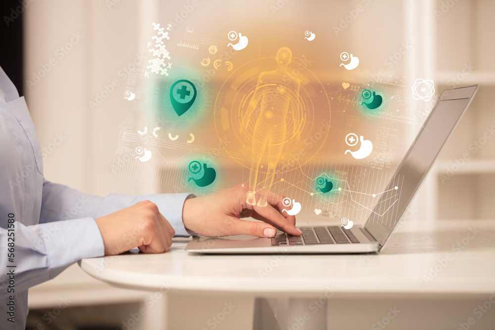 Doctor working on laptop with healthcare concept Doctor working on laptop with healthcare concept