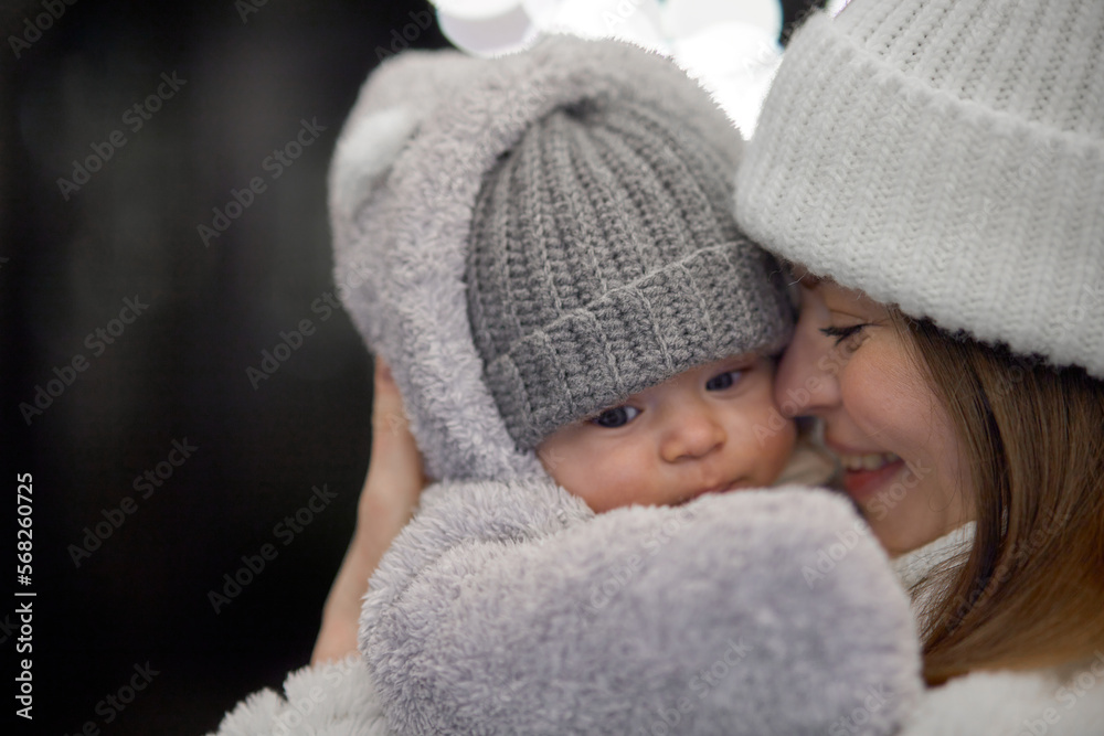 Close-up portrait of a 3-month-old baby, dressed in warm clothes for a walk on the street. Handsome baby. Close-up portrait of a 3-month-old baby, dressed in warm clothes for a walk on the street. Handsome baby.
