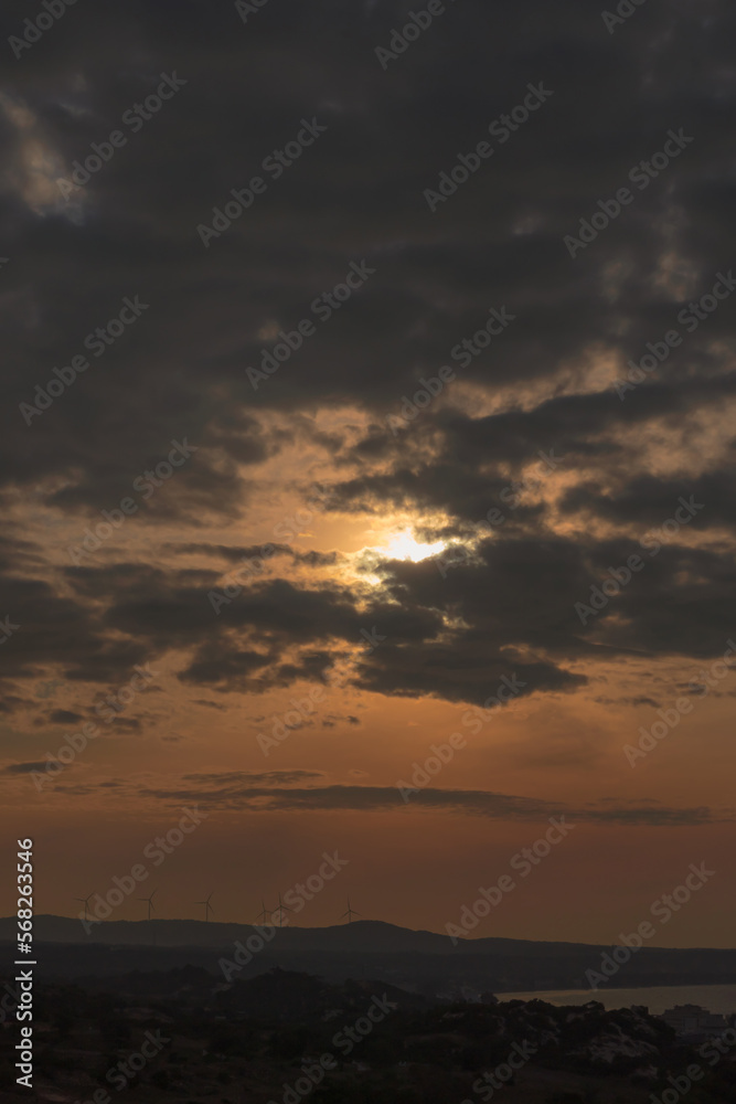 Abstract background sky Dawn Sunset Contrast dark shadow bright cloud sun orange silhouette above the mountains near the sea