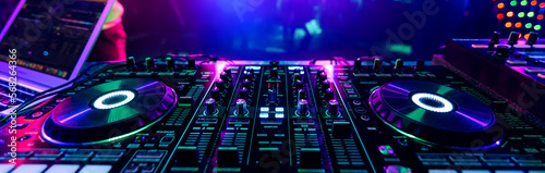 professional DJ music mixer at a party at an electronic music concert