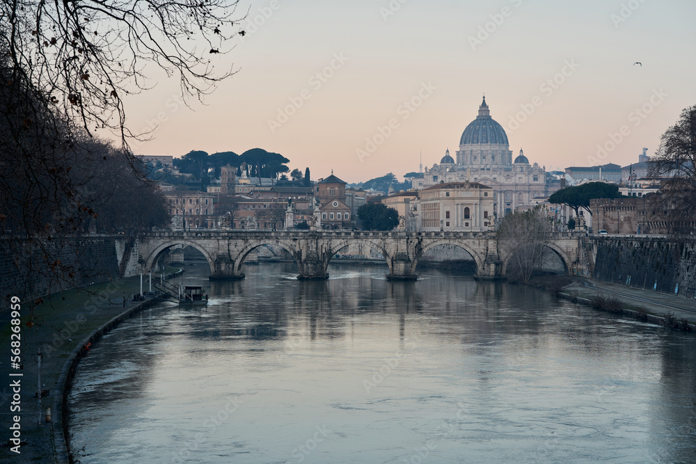 Ponte Sant'Angelo and St Peter Basilica at dawn in Rome, Italy	