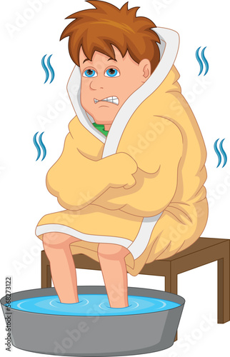boy cold with feet soaking in warm water