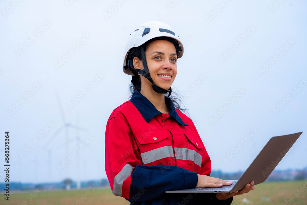 Female engineer or architect stands outdoors with laptop to work outside. Female engineer or architect stands outdoors with laptop to work outside.