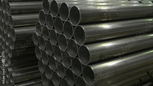 Stainless steel pipes in a warehouse of plant on production of metal pipes of a profile