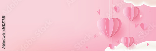 Valentine's, Mother's or Women's Day greeting card, banner or poster template. Holidays background with festive paper heart shaped decorations and empty background.