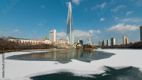 Time lapse 4k  of Seokchon lake park and Lotte World Tower in winter  at Seoul,South Korea.