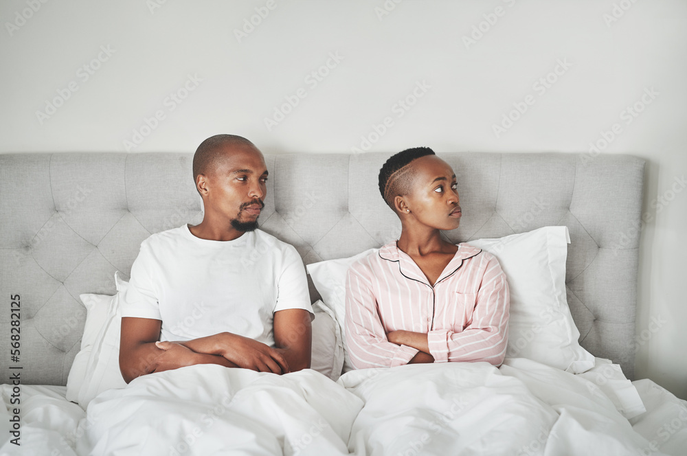 Fototapeta premium Stress, fight and black couple lying in bed angry, affair and divorce argument or insomnia. Mental health, relationship and depression, woman ignoring man frustrated with sexual problem in bedroom.