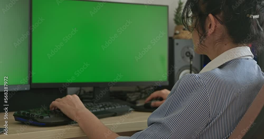 Young Woman Wearing Glasses Look Watch at Green Screen Monitor Desktop ...