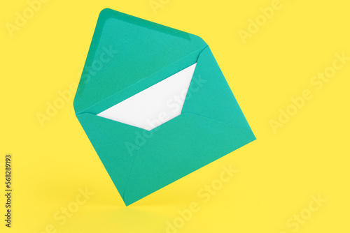 Open teal envelope with bla...
