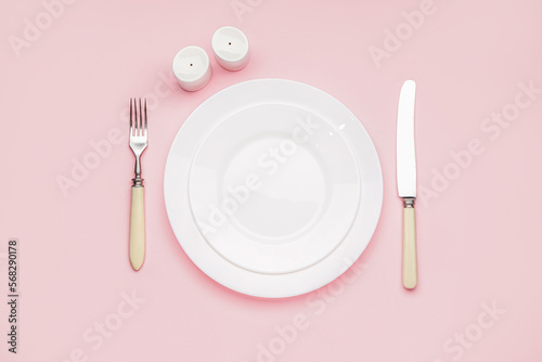 Table setting on pink background