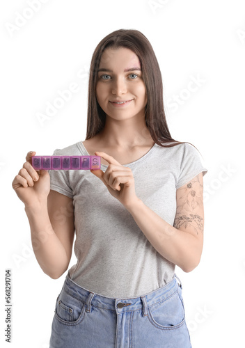 Young woman holding weekly ...