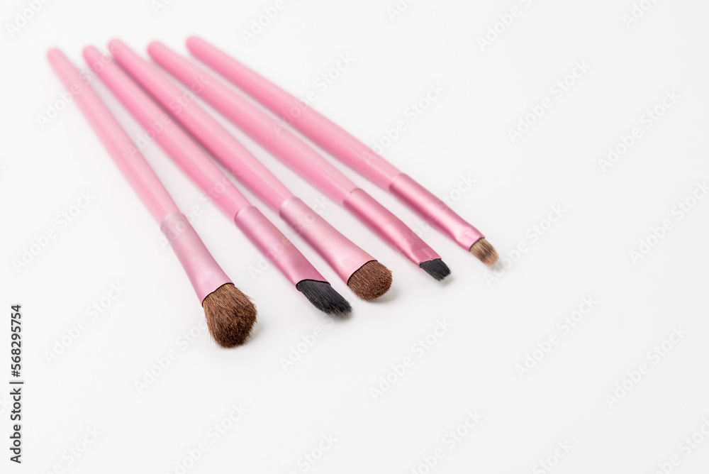 Cosmetic makeup brushes on white background, cosmetic product brushes set.