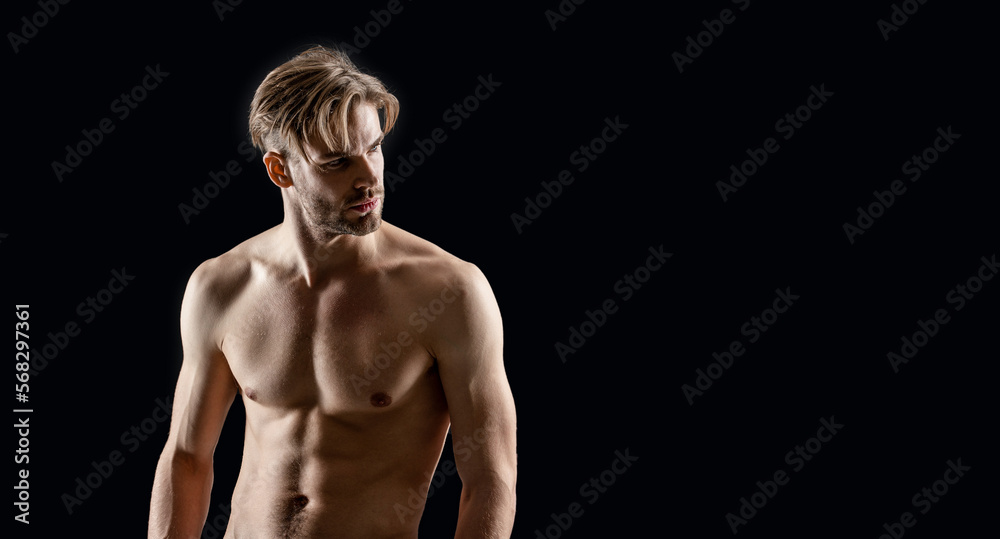 photo of macho muscular man with copy space. muscular macho man isolated on black background photo of macho muscular man with copy space. muscular macho man isolated on black background
