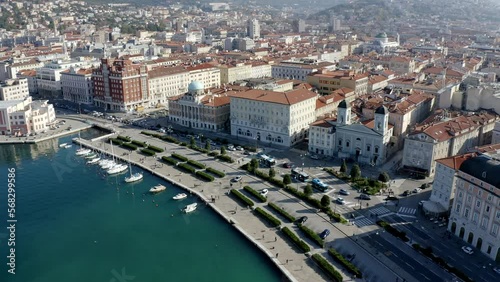 aerial drone shot of trieste city center from the sea on the canal grande ponterosso with hills in background photo
