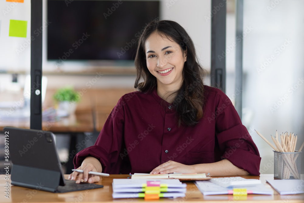 Young asian businesswoman working with analysis charts at office workplace, business finance and accounting concepts. Young asian businesswoman working with analysis charts at office workplace, business finance and accounting concepts.