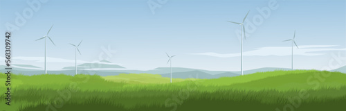 Countryside meadow panoramic landscape with wind turbines