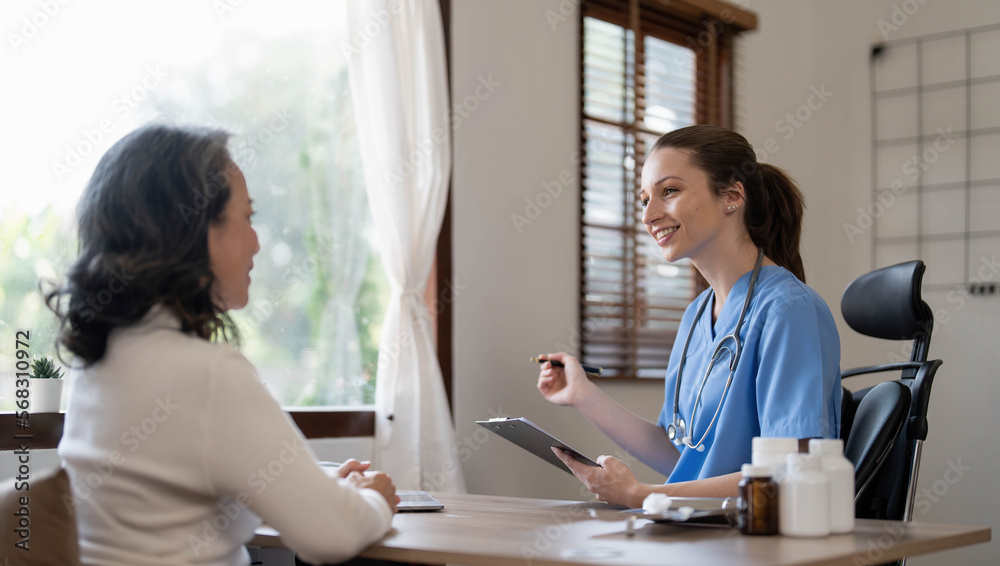 Obraz premium Asian Female Doctor examining and taking note on checklist paper with female patients in medical room.
