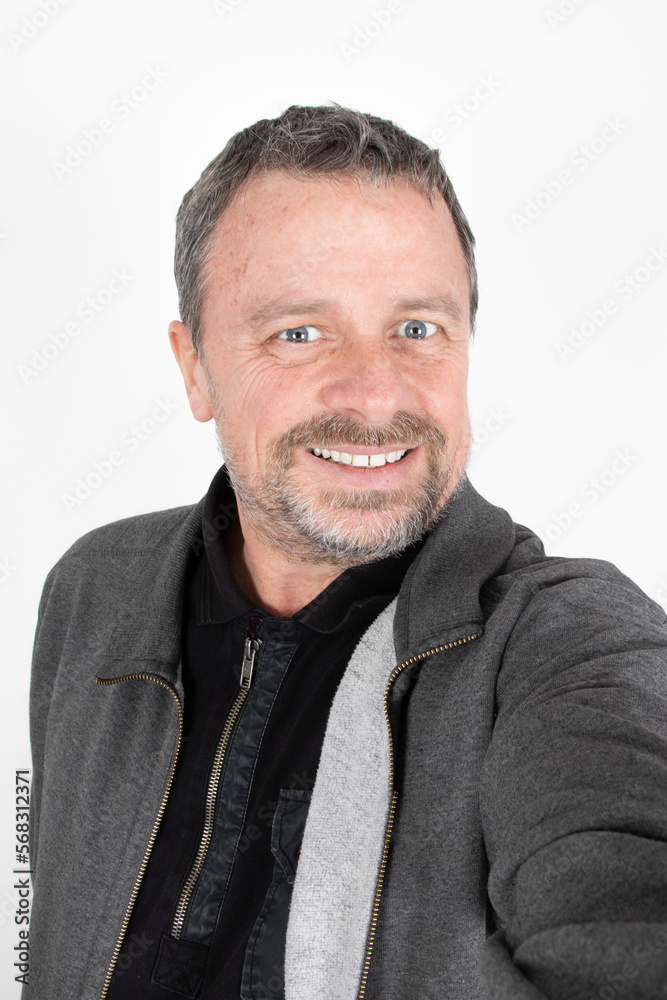 handsome fifty year old mature middle age man make cell phone selfie picture on white background handsome fifty year old mature middle age man make cell phone selfie picture on white background