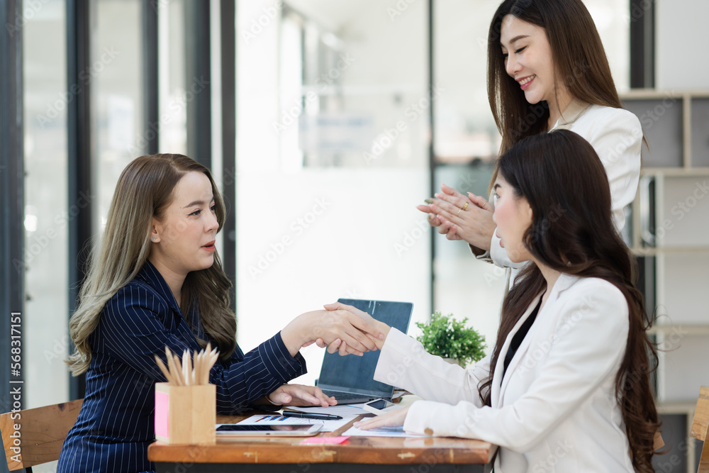 Group of young Asian business woman teamwork and presenting new projects in the office. Group of young Asian business woman teamwork and presenting new projects in the office.