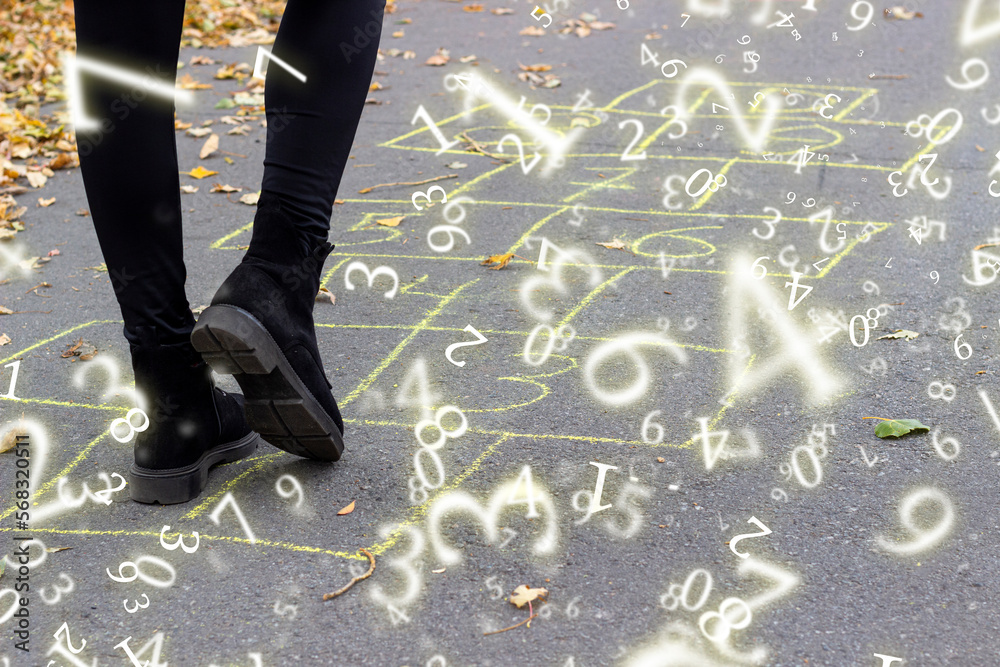 Φωτογραφία numerology, girl playing hopscotch game on the street, surrounded by numbers