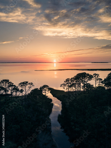 sunset over river photo