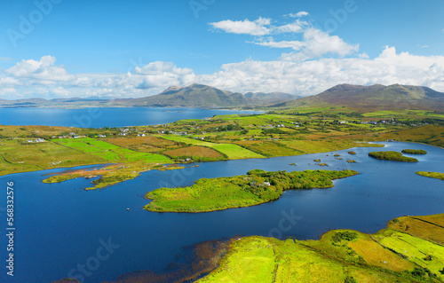 North east over Tully Lough to entrance to Killary Harbour and beyond to Mweelrea mountain. North Connemara, Ireland. Late summer photo
