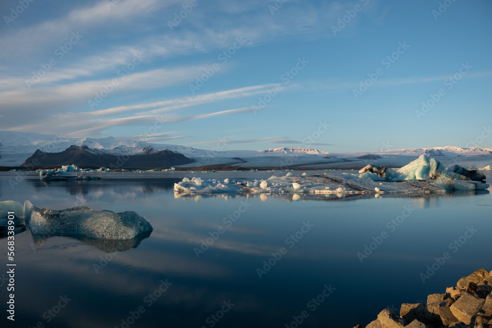 Iceland Jökulsárlón glacier lagoon lake with cloudy blue sky and ice floe