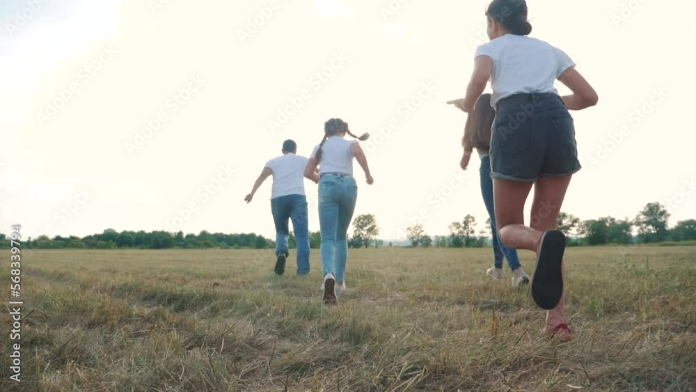 happy family children kids together run in park at sunset silhouette. people in park concept mom a dad lifestyle daughter and son joyful run. parents and little baby child fun summer vacation running happy family children kids together run in park at sunset silhouette. people in park concept mom a dad lifestyle daughter and son joyful run. parents and little baby child fun summer vacation running