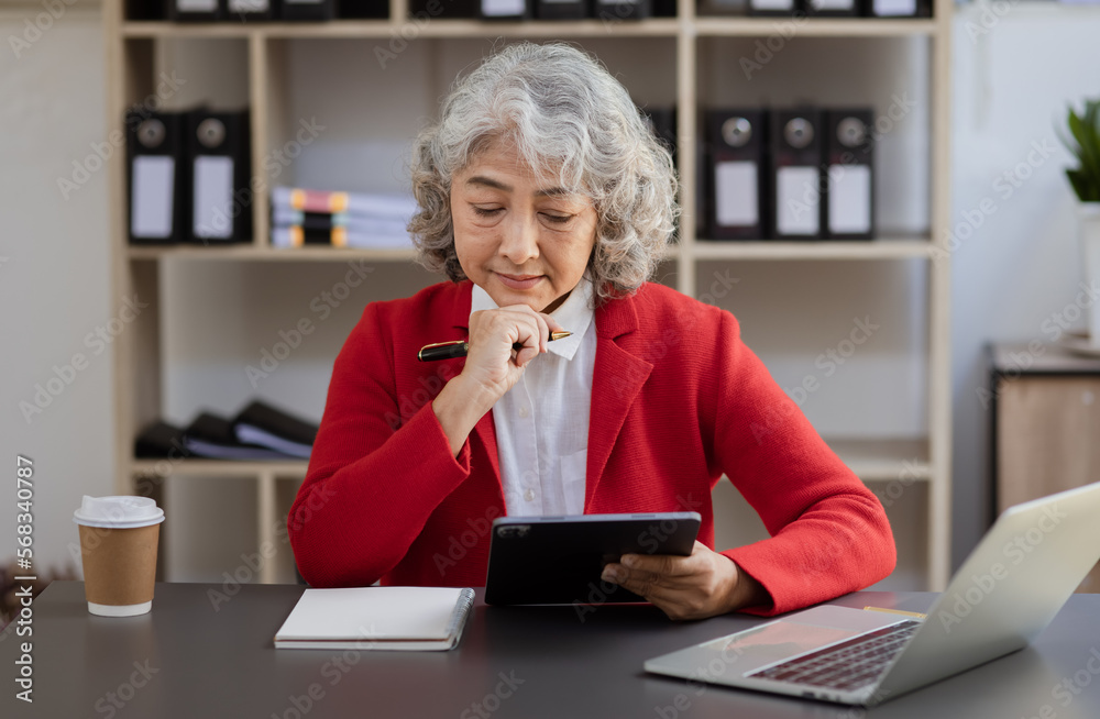 Manager woman working with tablet at office desk. Manager woman working with tablet at office desk.