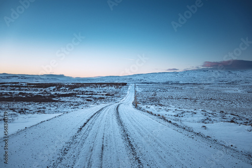 Iceland winter landscape with snow and road at blue sunset  © Simon Schmitt