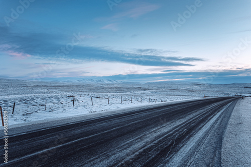 Iceland winter panorama road snow landscape with cloudy blue sky sunset